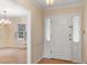 Inviting foyer with neutral walls and tiled floors, creating a warm welcome at 625 Mulberry St, Zionsville, IN 46077