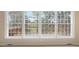 Large window with views of the backyard deck and landscaping at 625 Mulberry St, Zionsville, IN 46077