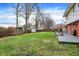 The expansive backyard includes a gray deck and a storage shed at 6537 Grosvenor Pl, Indianapolis, IN 46220