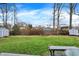 Large backyard featuring a storage shed and a well-kept lawn, ideal for outdoor activities at 6537 Grosvenor Pl, Indianapolis, IN 46220