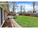 Enjoy the outdoors on the back deck with views of the well-maintained lawn and gardens at 6537 Grosvenor Pl, Indianapolis, IN 46220