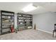 Unfinished basement with shelving units providing ample storage space at 6537 Grosvenor Pl, Indianapolis, IN 46220