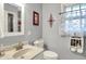Well-lit bathroom with modern fixtures, a vanity sink, and decorative accents at 6537 Grosvenor Pl, Indianapolis, IN 46220