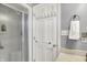 Bathroom featuring a glass shower and a convenient towel rack on the door at 6537 Grosvenor Pl, Indianapolis, IN 46220