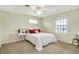 Bedroom with neutral walls, white trim, and a ceiling fan at 6537 Grosvenor Pl, Indianapolis, IN 46220