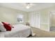 Bedroom featuring a ceiling fan and a window with a view of the backyard at 6537 Grosvenor Pl, Indianapolis, IN 46220