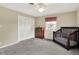 Cozy bedroom featuring a dark wood crib, gray carpet, and classic wooden dresser at 6537 Grosvenor Pl, Indianapolis, IN 46220