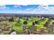 Scenic aerial of a well-maintained golf course featuring lush green fairways and manicured sand traps at 6537 Grosvenor Pl, Indianapolis, IN 46220