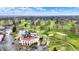 Aerial view showcasing the golf course and clubhouse, a perfect spot for relaxation and recreation at 6537 Grosvenor Pl, Indianapolis, IN 46220