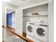 Upstairs laundry closet with washer and dryer at 6537 Grosvenor Pl, Indianapolis, IN 46220