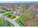 An aerial shot of the house showing its manicured lawn, mature trees and neighborhood at 7562 Black Walnut Dr, Avon, IN 46123