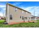 A view of the back of the property highlighting the spacious yard and outdoor patio at 7562 Black Walnut Dr, Avon, IN 46123