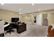 Finished basement with carpeting and space for a home office and workout area at 7562 Black Walnut Dr, Avon, IN 46123