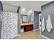 Bathroom showcasing double vanities, ceramic tile floors, and separate shower at 7562 Black Walnut Dr, Avon, IN 46123