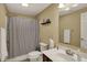 Cozy bathroom featuring a shower with striped curtain and a vanity with a large mirror at 7562 Black Walnut Dr, Avon, IN 46123
