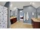 Spacious bathroom featuring double vanities, ceramic tile floors, and a separate shower at 7562 Black Walnut Dr, Avon, IN 46123