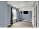 Bedroom with a window, curtains and a wall-mounted TV at 7562 Black Walnut Dr, Avon, IN 46123