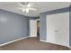 Bedroom featuring neutral carpet, a ceiling fan and a double door closet at 7562 Black Walnut Dr, Avon, IN 46123