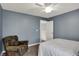 Bedroom featuring a ceiling fan, carpeted floors, and comfortable chair at 7562 Black Walnut Dr, Avon, IN 46123