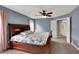 Bedroom featuring carpeted floors, a ceiling fan, and pink curtains at 7562 Black Walnut Dr, Avon, IN 46123