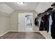Walk-in closet with carpet and built-in hanging shelves at 7562 Black Walnut Dr, Avon, IN 46123