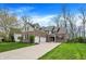 Beautiful brick home with a manicured lawn, complemented by a spacious driveway and attached two-car garage at 7562 Black Walnut Dr, Avon, IN 46123