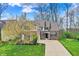 Charming brick home with well-manicured lawn and mature trees offering picturesque curb appeal at 7562 Black Walnut Dr, Avon, IN 46123