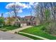 Spacious home with a three-car garage, large driveway and lush green yard showcasing ample outdoor space at 7562 Black Walnut Dr, Avon, IN 46123