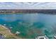 Stunning aerial view of the community lake with docks and well-maintained waterfront homes at 7653 River Rd, Indianapolis, IN 46240