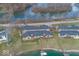 An aerial view featuring beautiful waterfront homes with docks, landscaping, and serene lake views at 7653 River Rd, Indianapolis, IN 46240