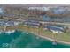 An aerial view of stunning lakeside homes with private docks for boating and waterfront living at 7653 River Rd, Indianapolis, IN 46240