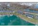 Stunning aerial view of waterfront homes, docks, and boats on a beautiful lakeside property at 7653 River Rd, Indianapolis, IN 46240