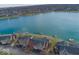 Stunning aerial view of the community, showcasing the beautiful lake and surrounding homes at 7653 River Rd, Indianapolis, IN 46240