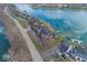 Aerial view of waterfront homes with private docks, scenic lake views, and community landscaping at 7653 River Rd, Indianapolis, IN 46240
