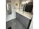 This bathroom boasts gray cabinets and countertops at 7653 River Rd, Indianapolis, IN 46240