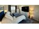 Comfortable bedroom with a large bed, dresser, and a view of the water at 7653 River Rd, Indianapolis, IN 46240