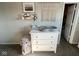 A changing table with elephant basket in a neutral colored Bedroom at 7653 River Rd, Indianapolis, IN 46240
