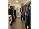 Walk-in closet with ample hanging and shelving space for organized storage at 7653 River Rd, Indianapolis, IN 46240