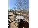 This outdoor deck has comfortable seating with lovely wooded views at 7653 River Rd, Indianapolis, IN 46240