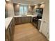 Modern kitchen features stainless steel appliances and a bright window view at 7653 River Rd, Indianapolis, IN 46240