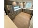 A modern kitchen features stainless steel appliances, a sleek countertop, and wooden floors at 7653 River Rd, Indianapolis, IN 46240