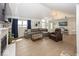 Spacious living room with high ceilings, a fireplace, and a view into the cozy breakfast nook at 7653 River Rd, Indianapolis, IN 46240