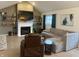 Cozy living room showcasing a fireplace, mounted TV, comfortable seating, and plenty of natural light at 7653 River Rd, Indianapolis, IN 46240