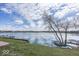 Picturesque waterfront view with boats docked along the shoreline, reflecting the blue sky at 7653 River Rd, Indianapolis, IN 46240