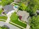 Aerial view of property highlighting the pool, brick home and landscaping and the serene residential setting at 7732 Ashtree Dr, Indianapolis, IN 46259
