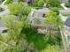 Aerial image of a spacious backyard featuring a lush lawn and a stone patio area at 7732 Ashtree Dr, Indianapolis, IN 46259