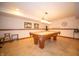Basement area featuring a billiards table with a light fixture and some furniture at 7732 Ashtree Dr, Indianapolis, IN 46259