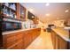 Basement wet bar includes sleek appliances and granite countertops, perfect for entertaining at 7732 Ashtree Dr, Indianapolis, IN 46259