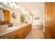 Bathroom featuring double vanity, and a soaking tub for a relaxing experience at 7732 Ashtree Dr, Indianapolis, IN 46259