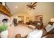 Comfortable living room features a brick fireplace, leather seating, and natural light at 7732 Ashtree Dr, Indianapolis, IN 46259
